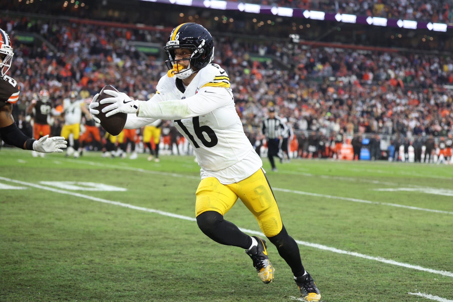 Pittsburgh Steelers wide receiver Adam Thielen (16) runs with the ball after a catch in the fourth quarter against the Cleveland Browns at Huntington Bank Field.