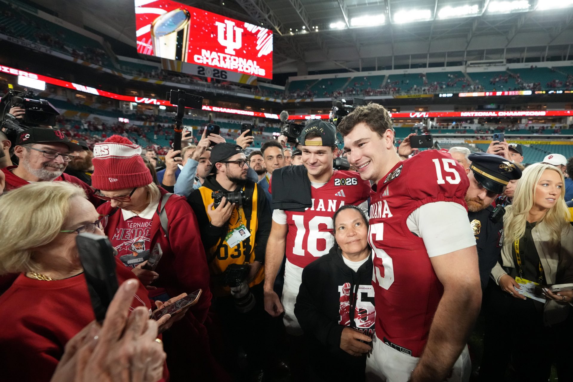 Indiana Hoosiers quarterback Alberto Mendoza (16) and quarterback Fernando Mendoza (15) pose for photos after the College Football Playoff National Championship game against the Miami Hurricanes at Hard Rock Stadium.