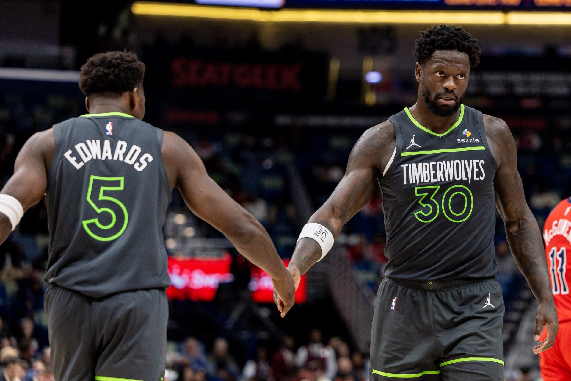 Minnesota Timberwolves forward/center Julius Randle (30) claps hands with guard Anthony Edwards (5) after a play against the New Orleans Pelicans during the second half at Smoothie King Center.
