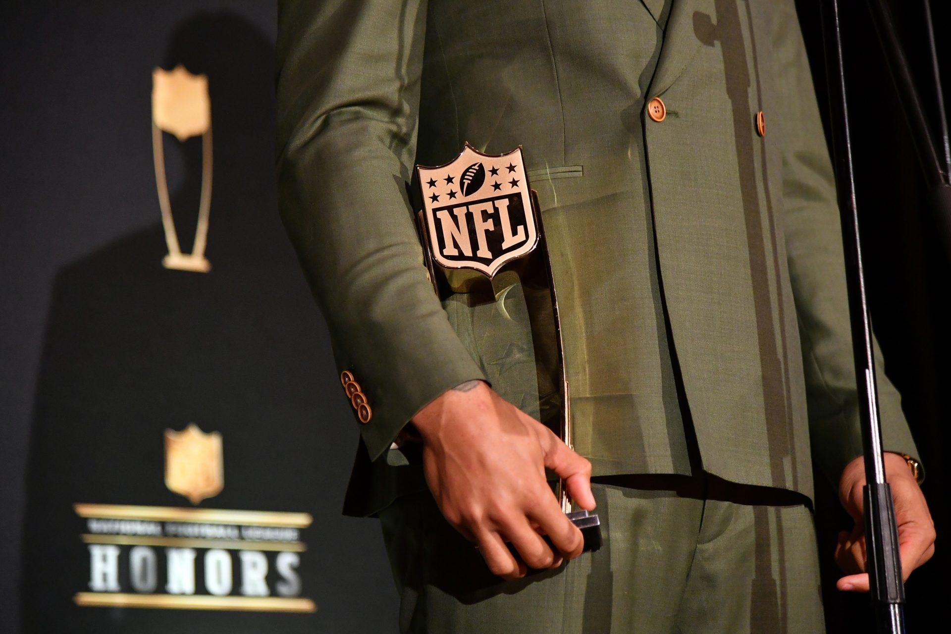 New England Patriots Stephon Gilmore holds the AP Defensive Player of the Year presented by Old Spice during the NFL Honors awards presentation at Adrienne Arsht Center.