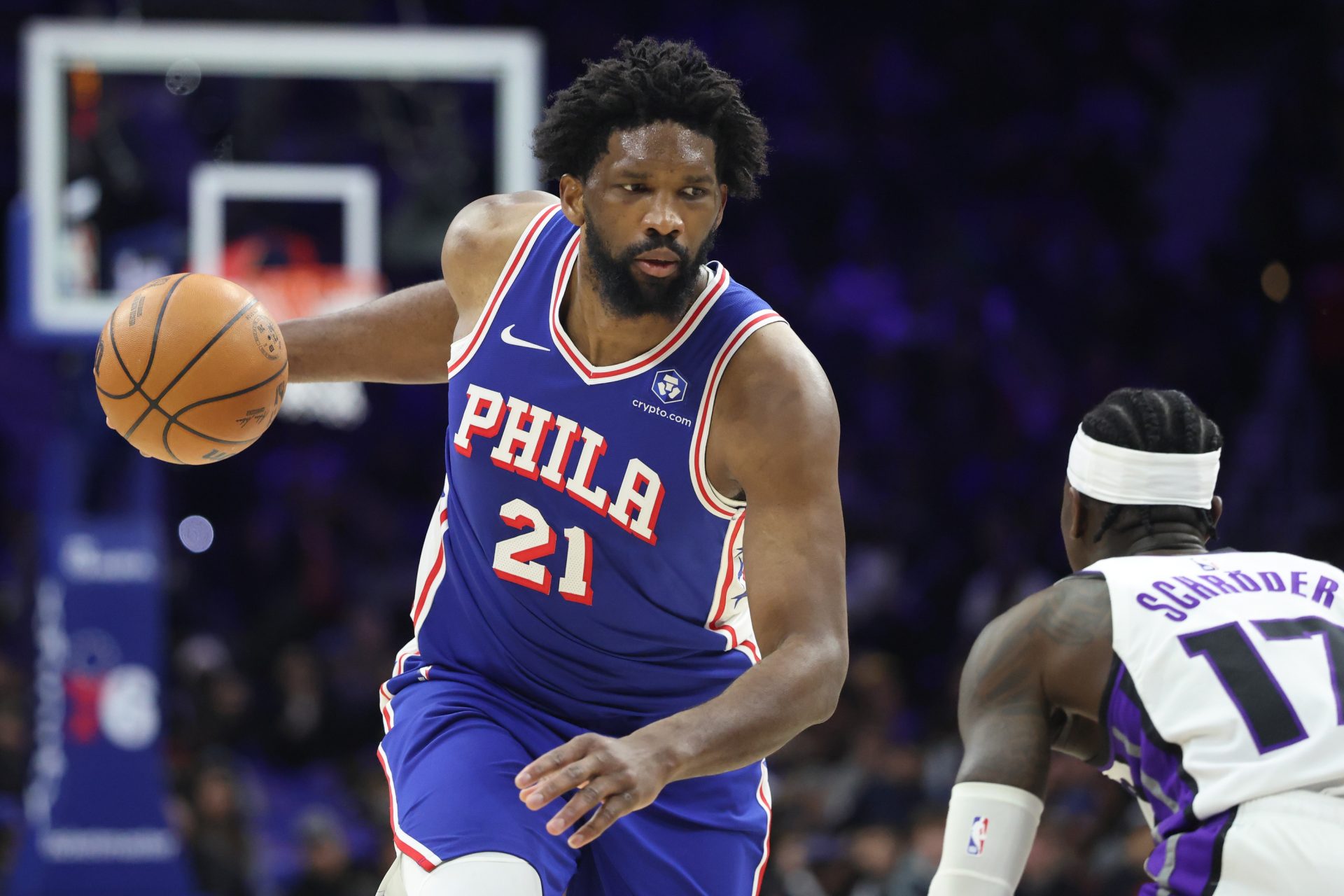 Philadelphia 76ers center Joel Embiid (21) controls the ball against Sacramento Kings guard Dennis Schroder (17) during the third quarter at Xfinity Mobile Arena.