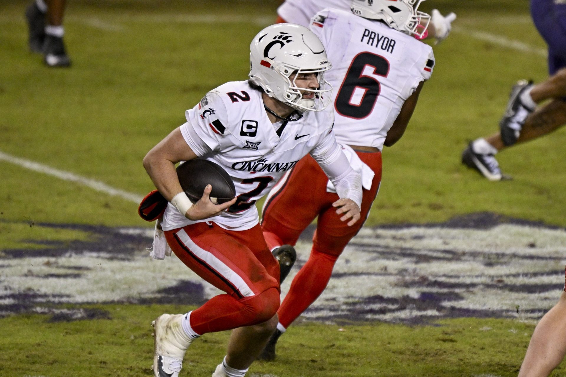 Cincinnati Bearcats quarterback Brendan Sorsby (2) runs with the ball during the game between the Horned Frogs and the Bearcats at Amon G. Carter Stadium.