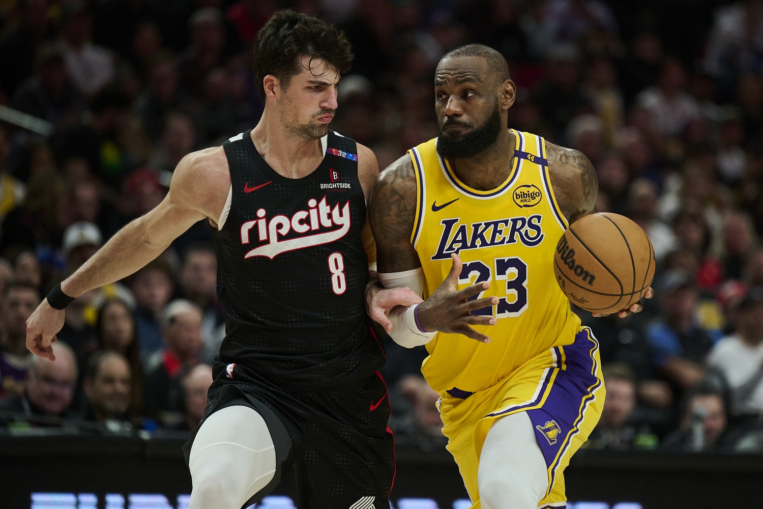 Los Angeles Lakers forward LeBron James (23) drives to the basket during the second half against Portland Trail Blazers forward Deni Avdija (8) at Moda Center.