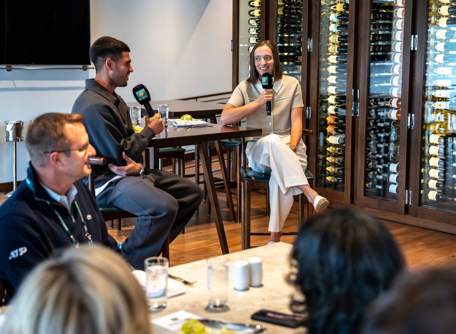 2024 champions Iga Swiatek and Carlos Alcaraz sit for the champions luncheon at Porta Via in Stadium 1 at the BNP Paribas Open in Indian Wells, Calif., Wednesday, March 5, 2025.