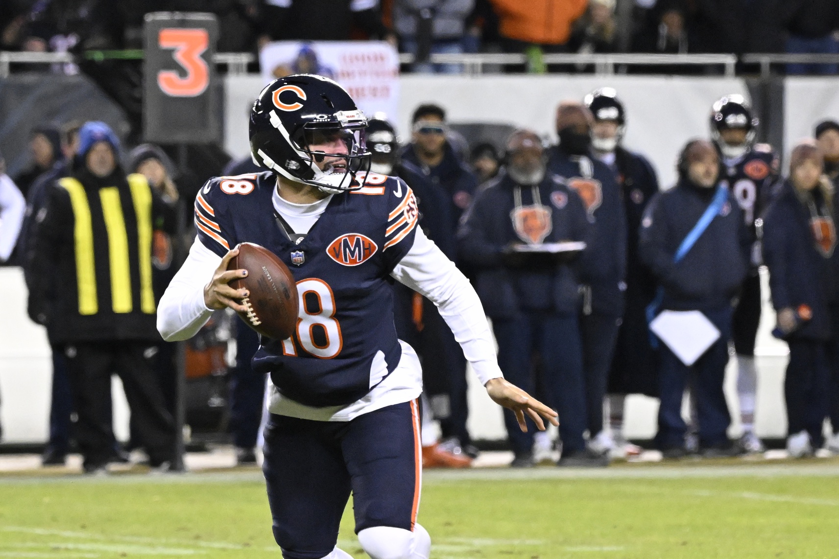 Chicago Bears quarterback Caleb Williams (18) looks downfield against the Green Bay Packers during the first half of an NFC Wild Card Round game at Soldier Field.