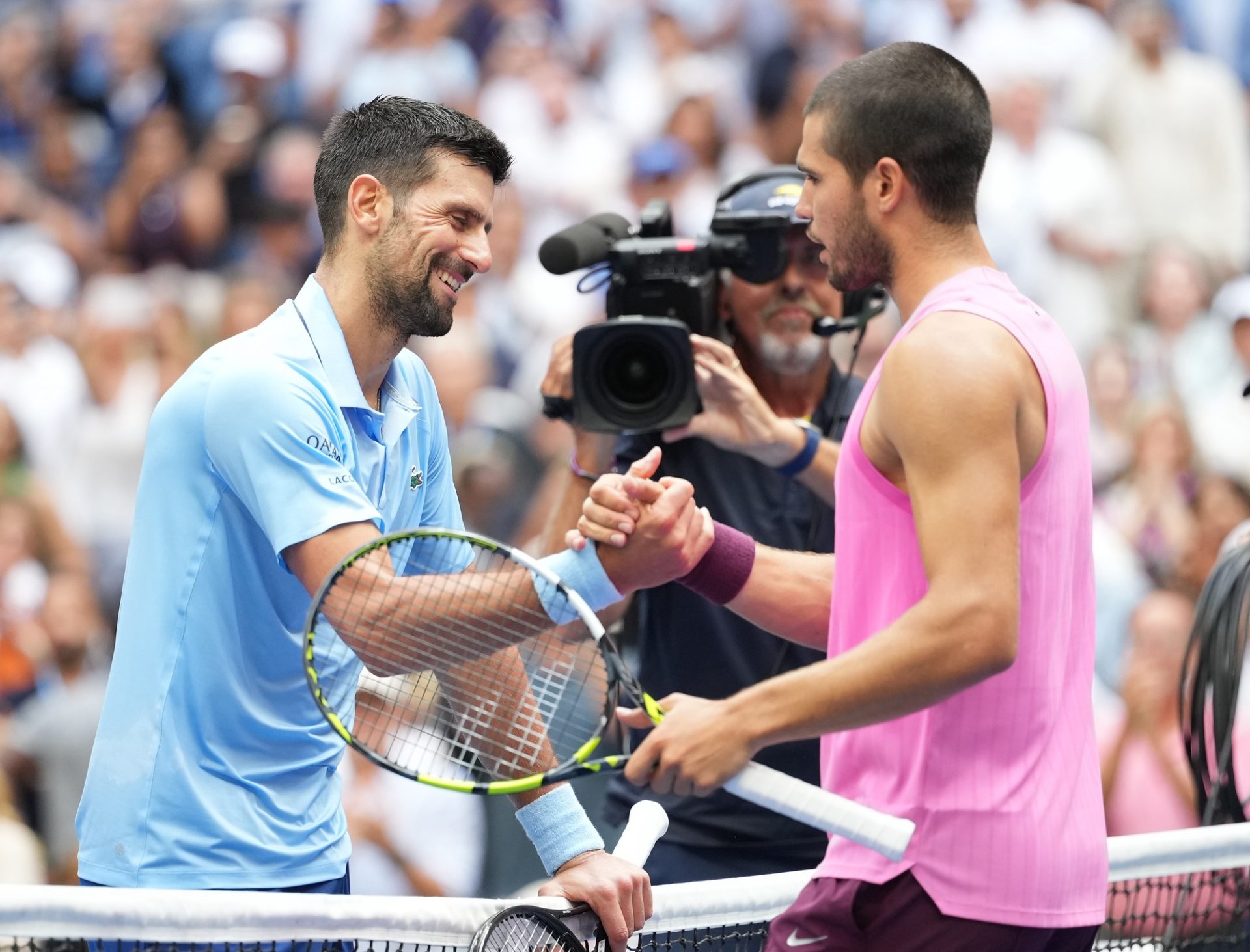 Carlos Alcaraz (right) (ESP) after beating Novak Djokovic (SRB) (left) on day thirteen of the 2025 U.S. Open tennis tournament at the USTA Billie Jean King National Tennis Center.