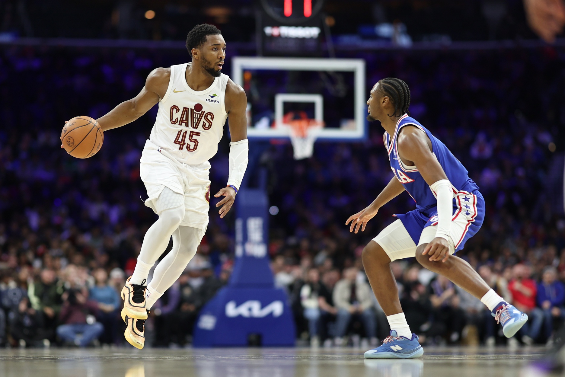 Cleveland Cavaliers guard Donovan Mitchell (45) controls the ball against Philadelphia 76ers guard Tyrese Maxey (0) during the third quarter at Xfinity Mobile Arena.
