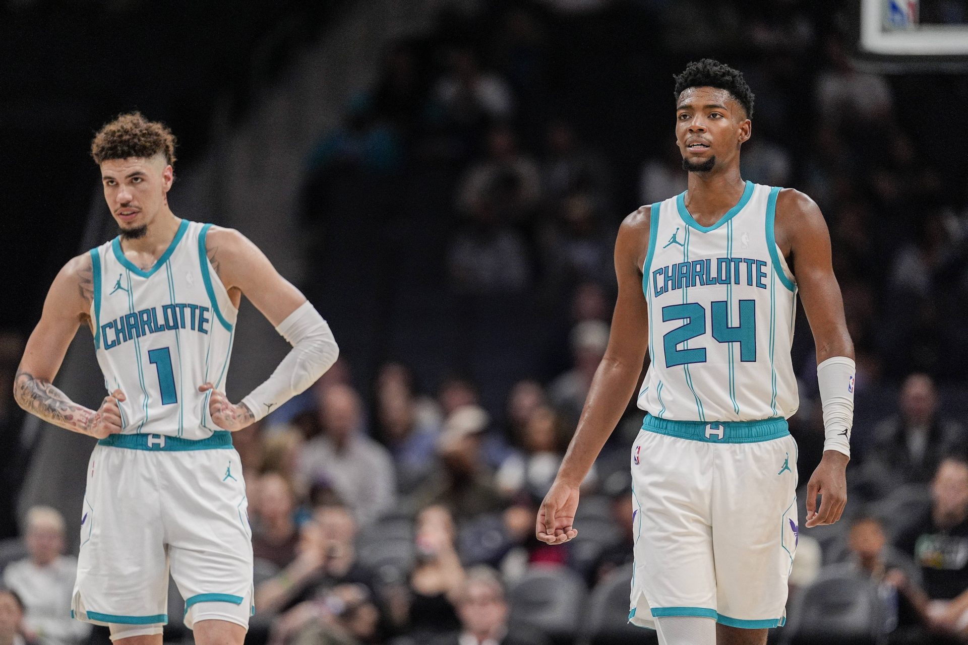 Charlotte Hornets guard LaMelo Ball (1) and forward Brandon Miller (24) at mid court against the Miami Heat during the second half at Spectrum Center.