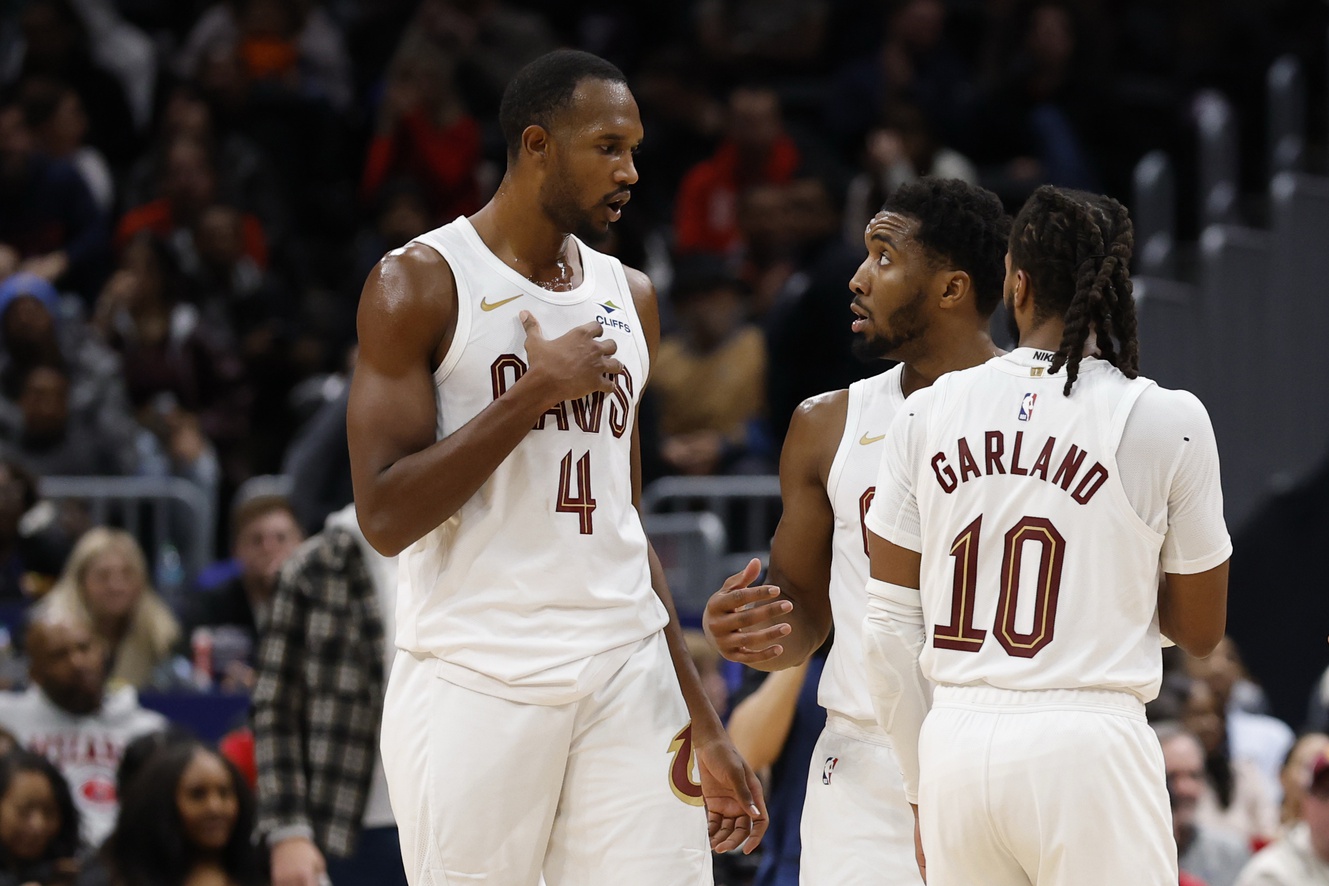 Cleveland Cavaliers guard Donovan Mitchell (45) talks with Cavaliers center Evan Mobley (4) and Cavaliers guard Darius Garland (10) during a stoppage in play against the Washington Wizards in the second half at Capital One Arena.