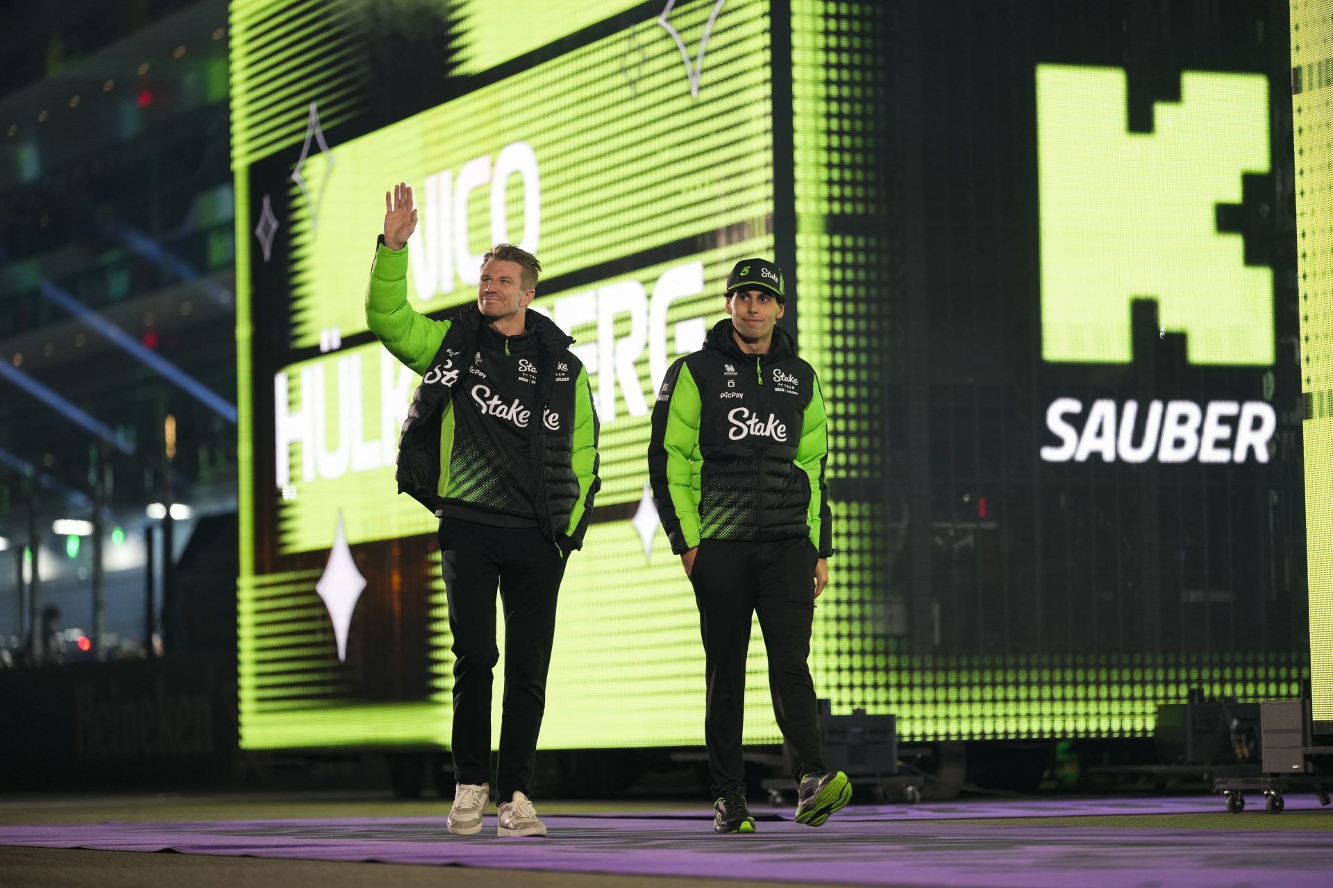 Sauber driver Nico Hulkenberg (27), left, and Sauber driver Gabriel Bortoleto (5) arrive for the Las Vegas Grand Prix drivers parade at the Las Vegas Strip Circuit.