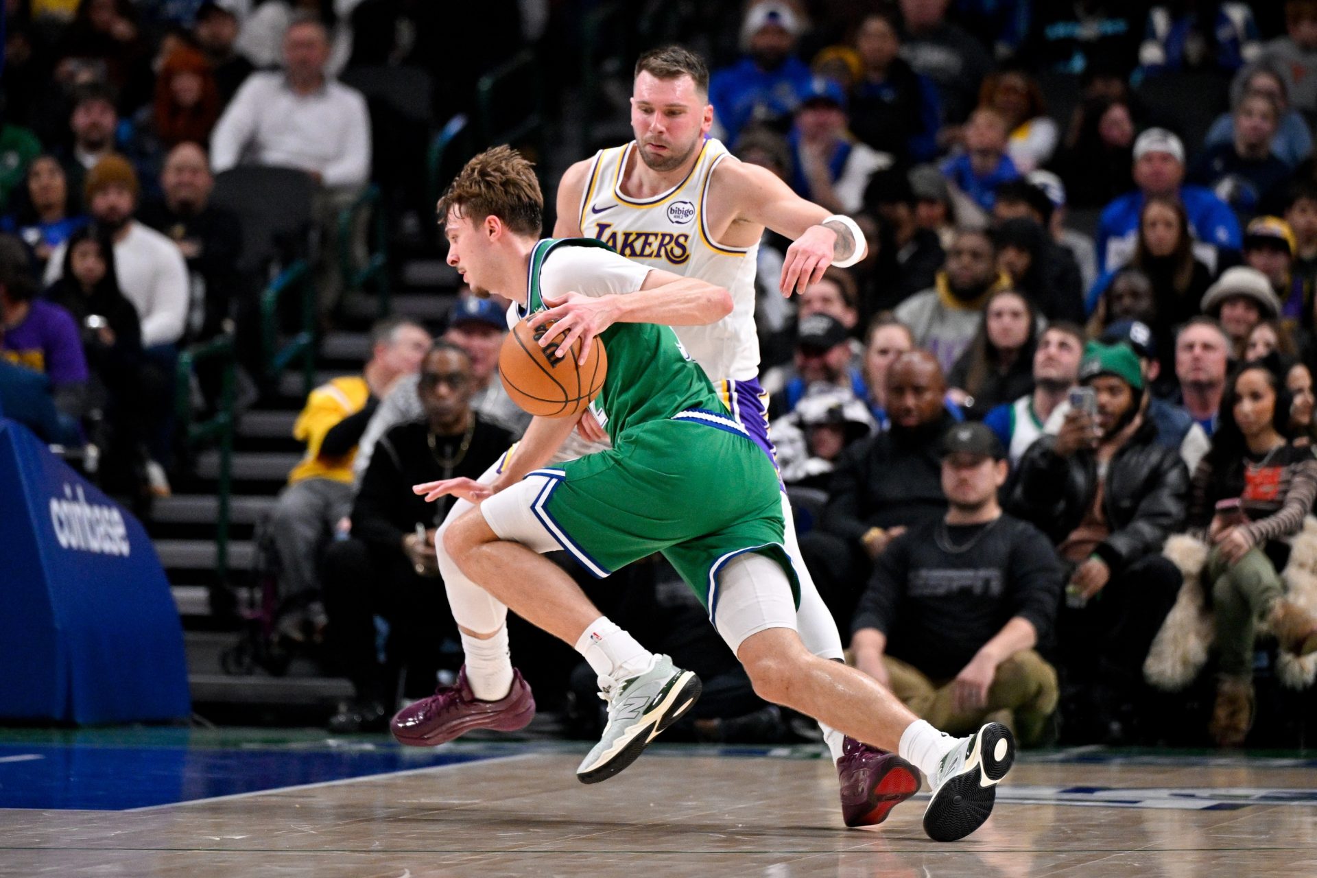 Dallas Mavericks forward Cooper Flagg (32) moves the ball to the basket past Los Angeles Lakers guard Luka Doncic (77) during the second half at the American Airlines Center.