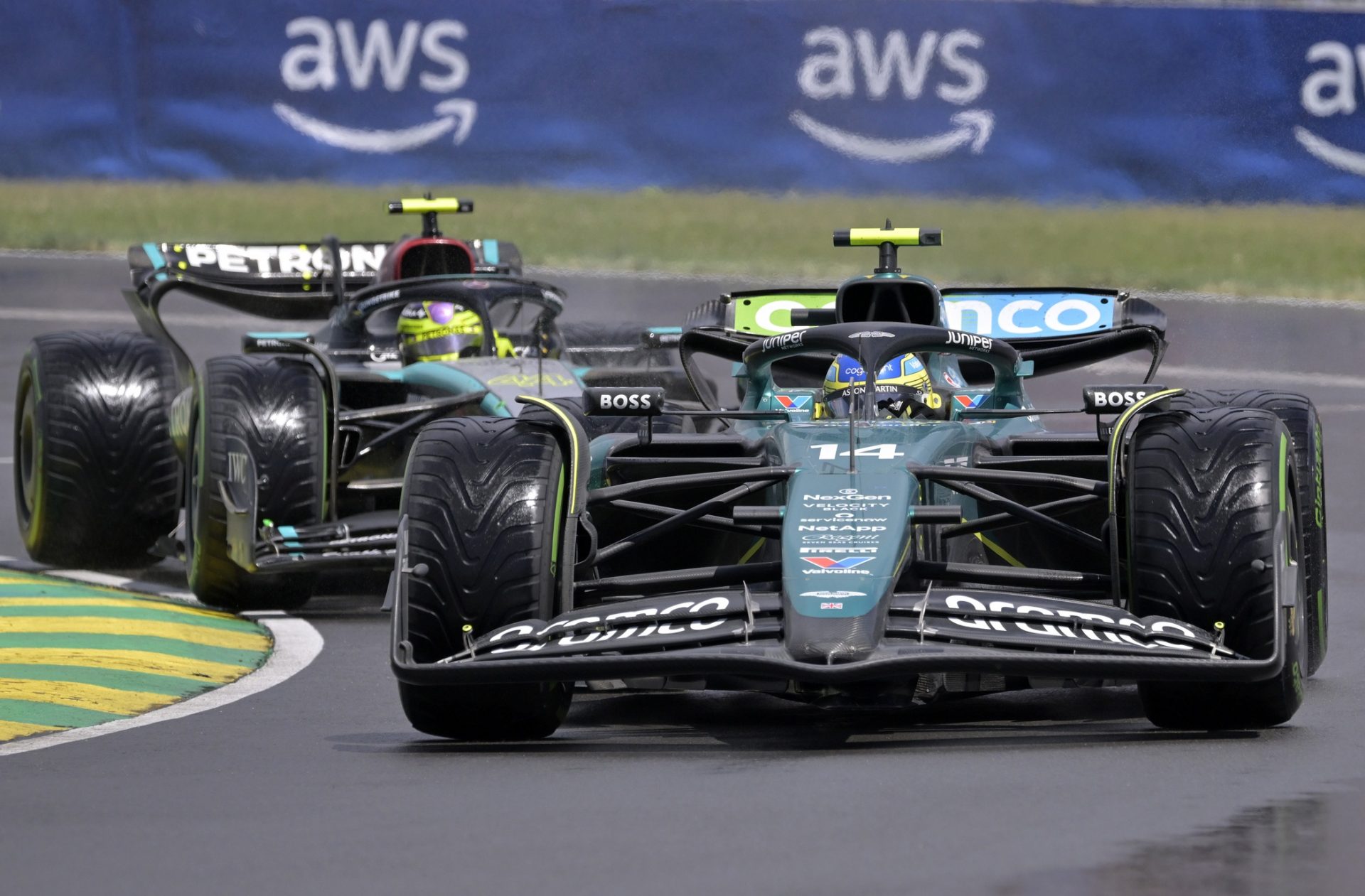 Aston Martin driver Fernando Alonso (ESP) and Mercedes driver Lewis Hamilton (GBR) race during the Canadian Grand Prix at Circuit Gilles Villeneuve.