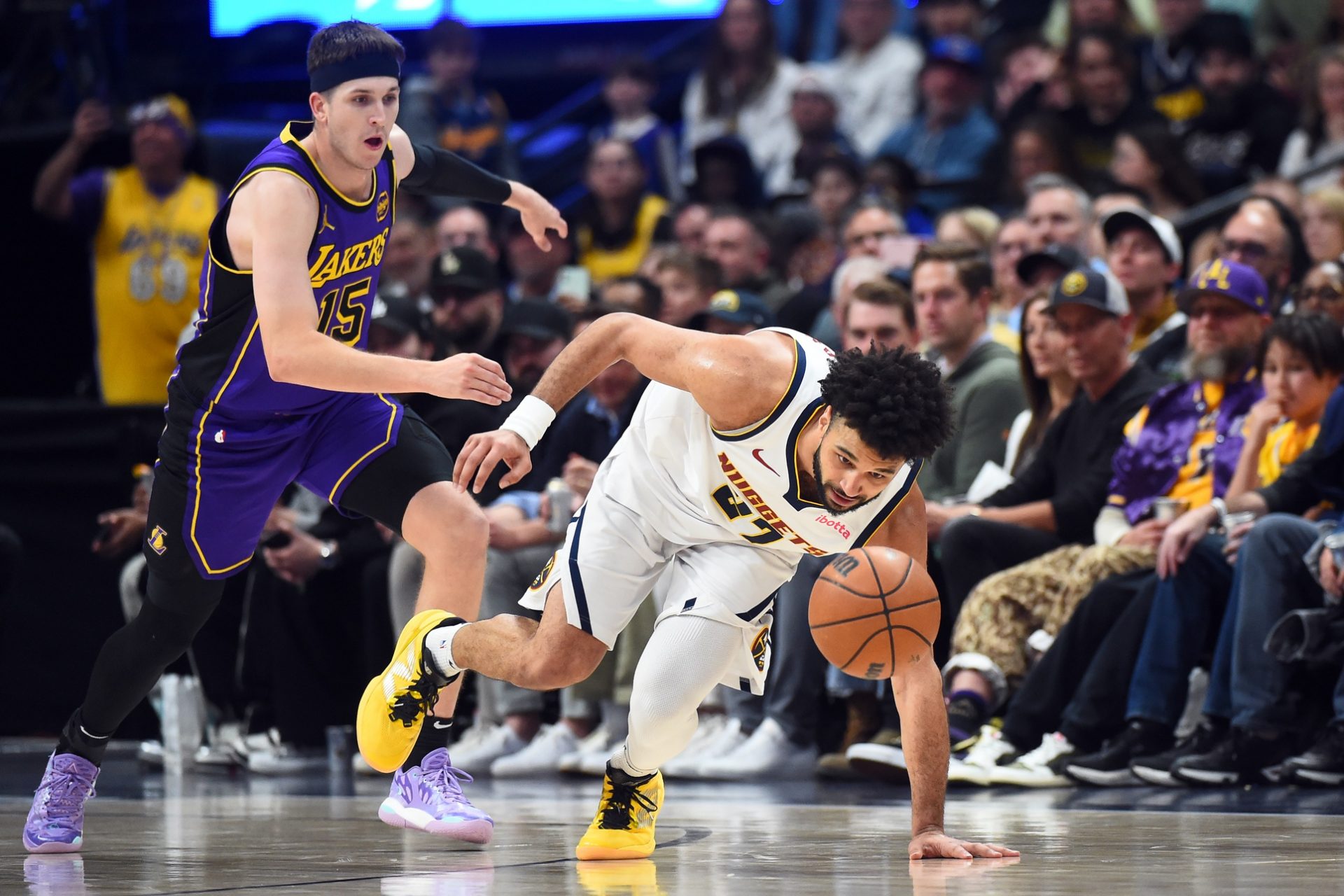 Denver Nuggets guard Jamal Murray (27) chases down a loose ball during the second half against the Los Angeles Lakers at Ball Arena.