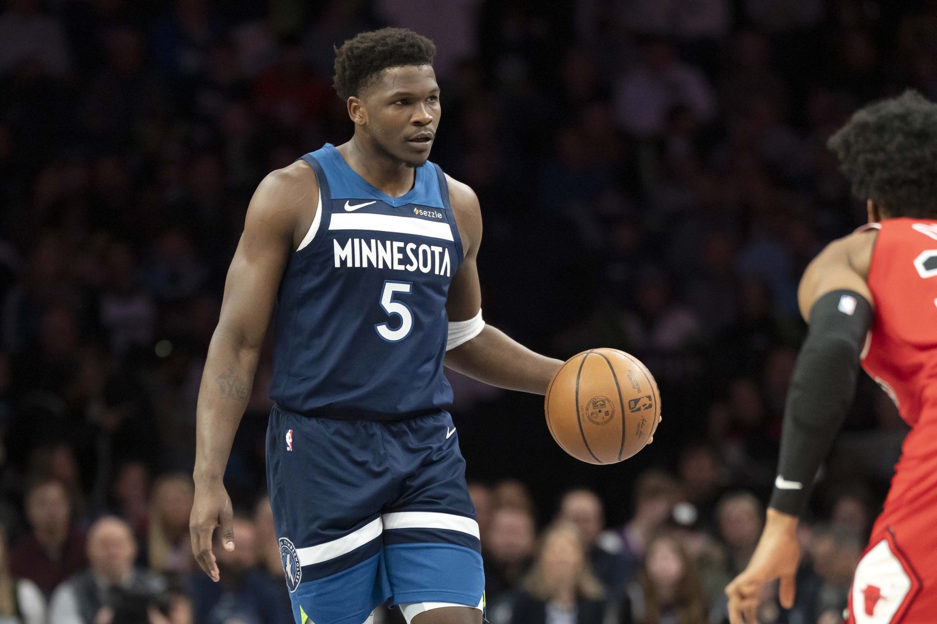 Minnesota Timberwolves guard Anthony Edwards (5) dribbles the ball against the Chicago Bulls in the first half at Target Center.