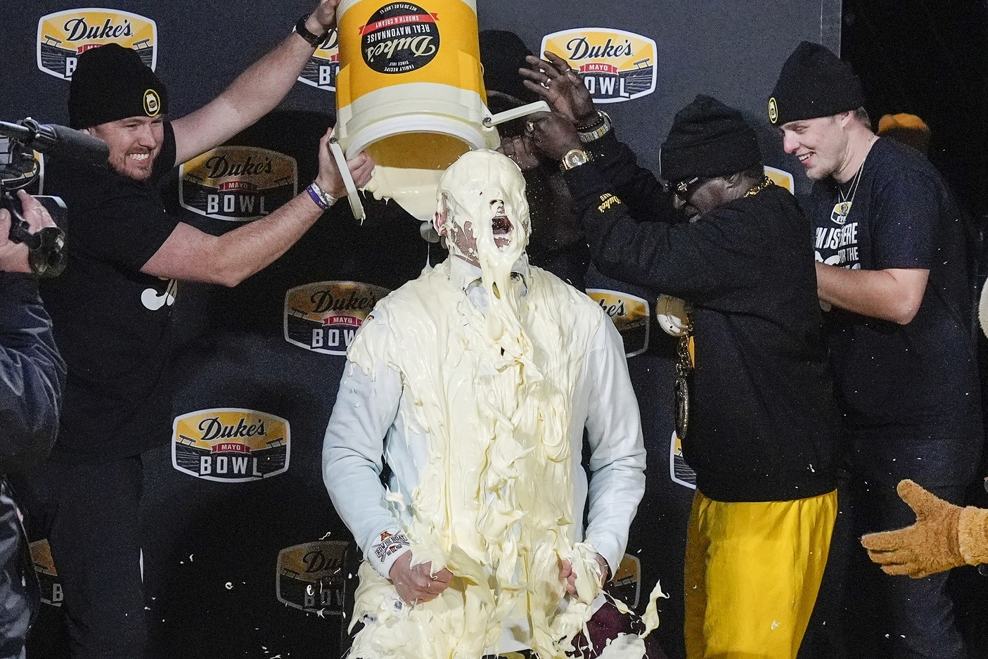 Minnesota Golden Gophers head coach P.J. Fleck reacts to the mayo dump after his teams’ win over Virginia Tech Hokies  at the Duke’s Mayo Bowl at Bank of America Stadium.