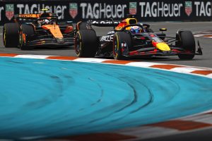 May 4, 2025; Miami Gardens, FL, USA; Red Bull driver Max Verstappen (1) leads McLaren driver Lando Norris (4) during the F1 Miami Grand Prix at Miami International Autodrome. Mandatory Credit: Peter Casey-Imagn Images