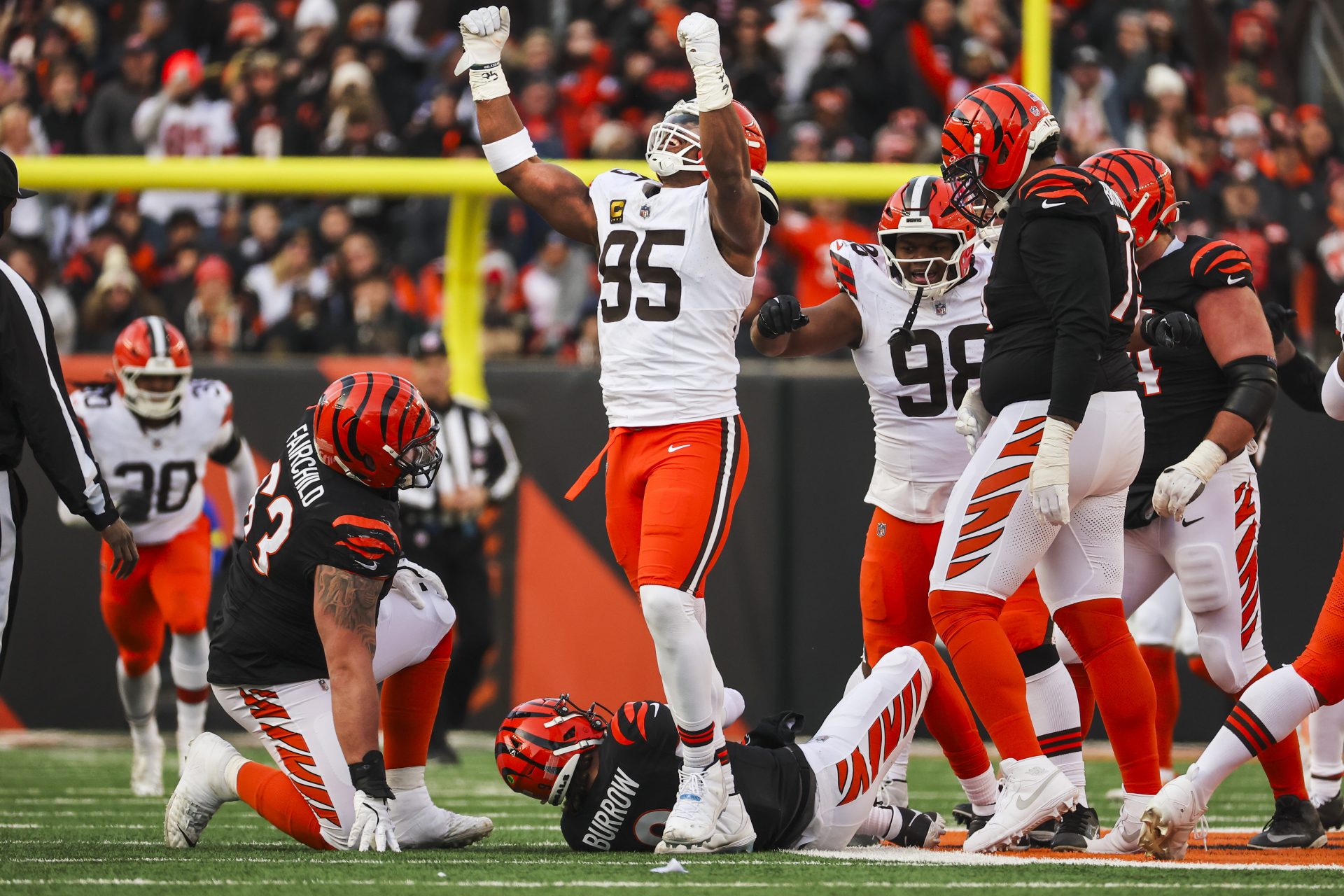 Cleveland Browns defensive end Myles Garrett (95) celebrates after sacking Cincinnati Bengals quarterback Joe Burrow (9) during the fourth quarter at Paycor Stadium. The play set a new NFL single season sack record by Garrett.
