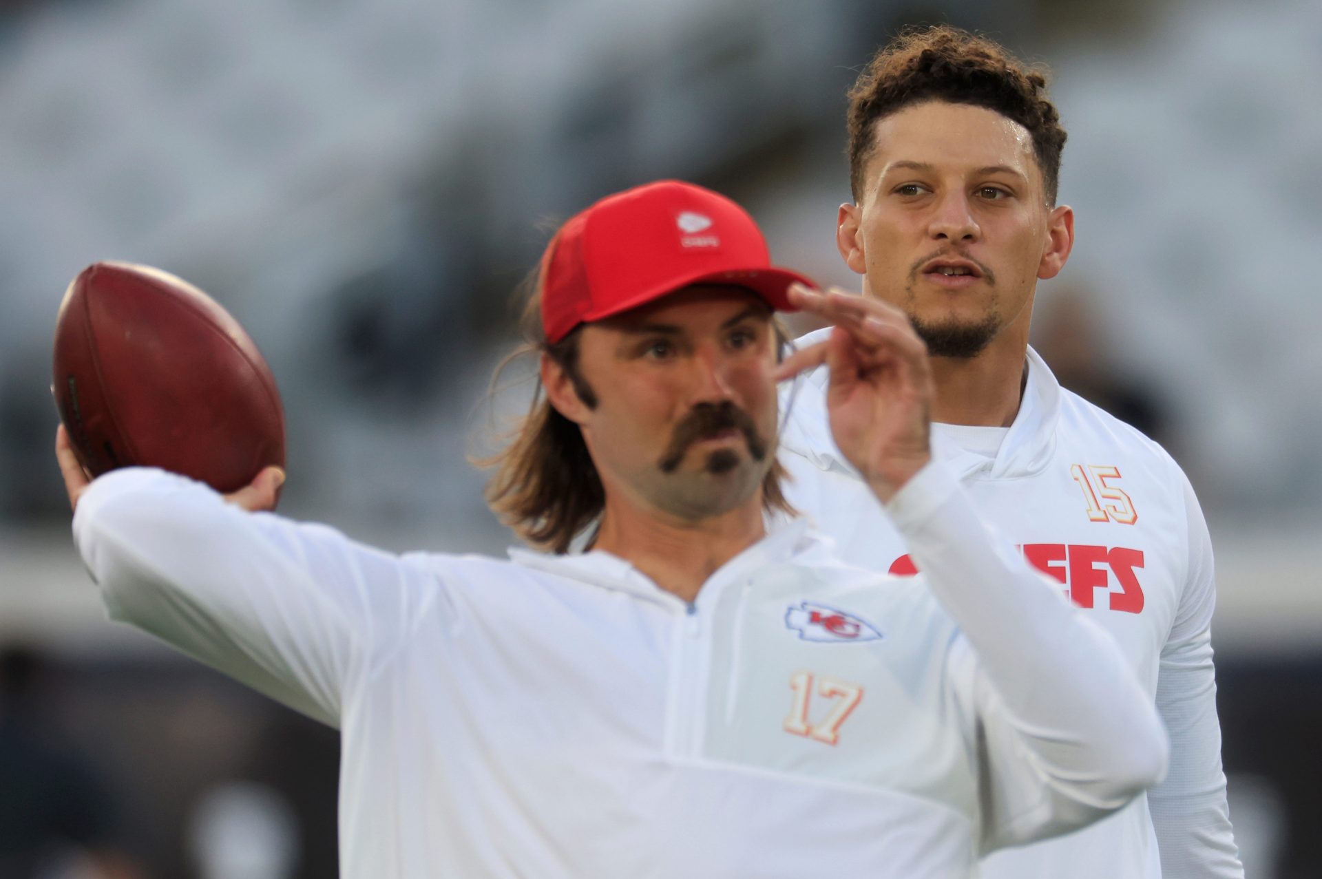 Kansas City Chiefs quarterback Patrick Mahomes (15) looks on as quarterback Gardner Minshew (17) warms up before an NFL football matchup at EverBank Stadium, Monday, Oct. 6, 2025, in Jacksonville, Fla. The Jacksonville Jaguars edged the Kansas City Chiefs 31-28. [Corey Perrine/Florida Times-Union]