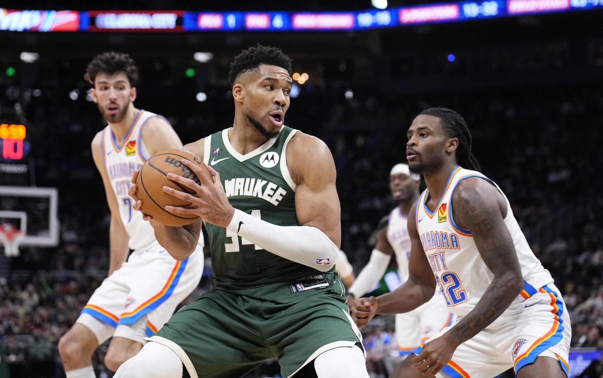 Milwaukee Bucks forward Giannis Antetokounmpo (34) drives to the basket against Oklahoma City Thunder guard Cason Wallace (22) in the second half at Fiserv Forum.