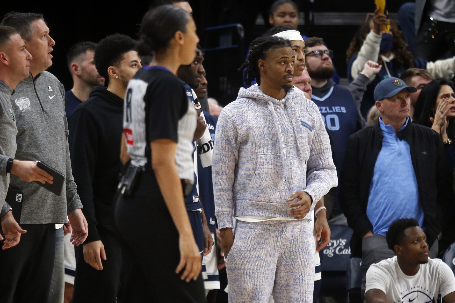 Memphis Grizzlies guard Ja Morant (12) looks on from the bench area during the fourth quarter against the New Orleans Pelicans at FedExForum.