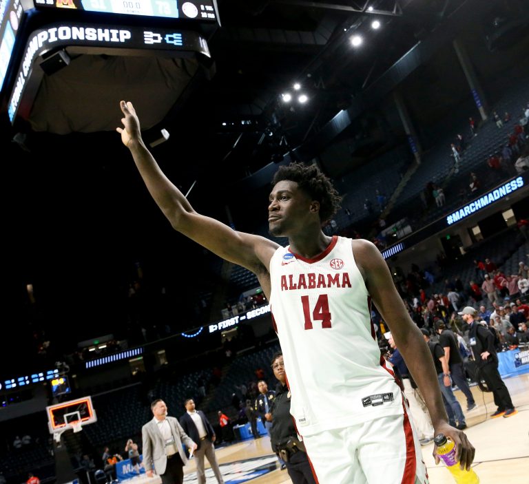 Alabama center Charles Bediako (14) gestures as he leaves the court at Legacy Arena in Birmingham, Alabama, during the second round of the NCAA Tournament on March 18, 2023.