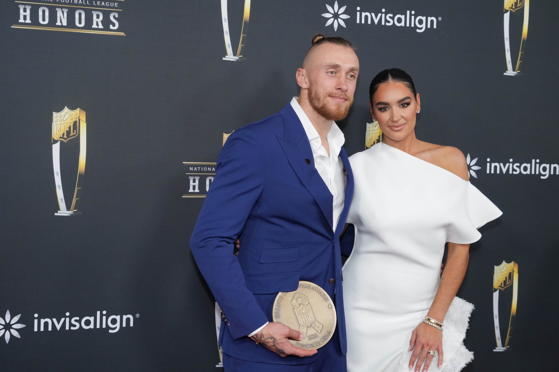 George Kittle and Claire Kittle on the red carpet before Super Bowl LIX NFL Honors at Saenger Theatre.