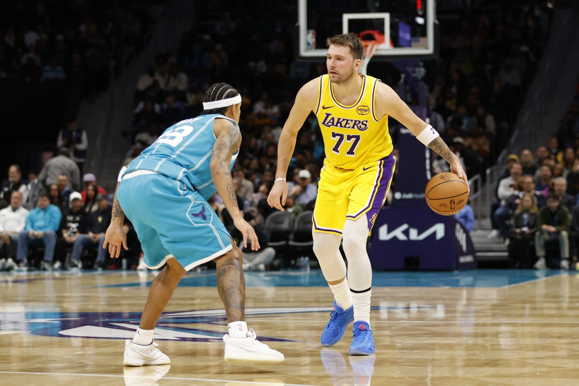 Los Angeles Lakers forward/guard Luka Doncic (77) is guarded by Charlotte Hornets guard Tre Mann (23) during the second quarter at Spectrum Center.