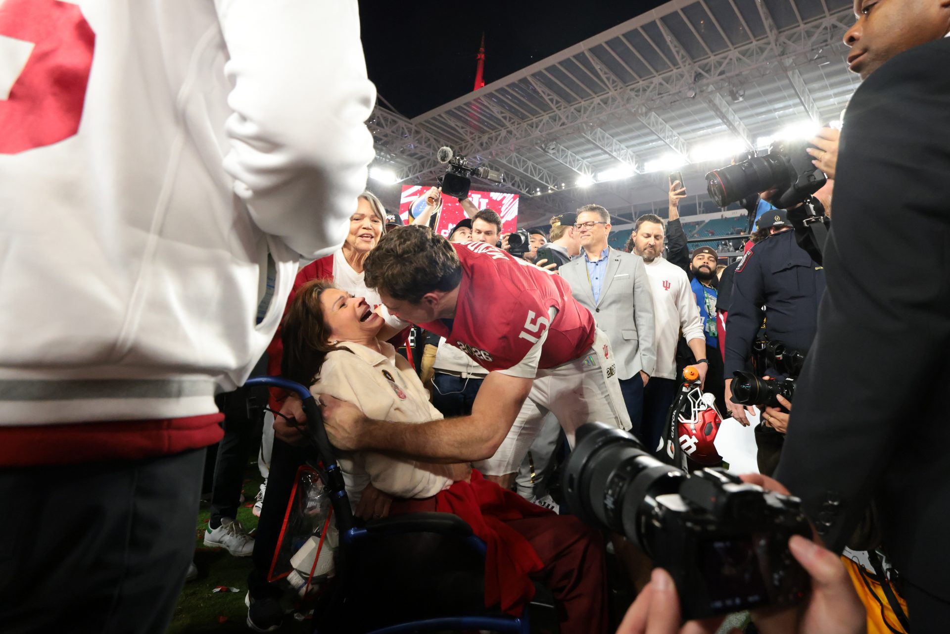 Indiana Hoosiers quarterback Fernando Mendoza (15) hugs his mother, Elsa Mendoza, after the College Football Playoff National Championship game against the Miami Hurricanes at Hard Rock Stadium.