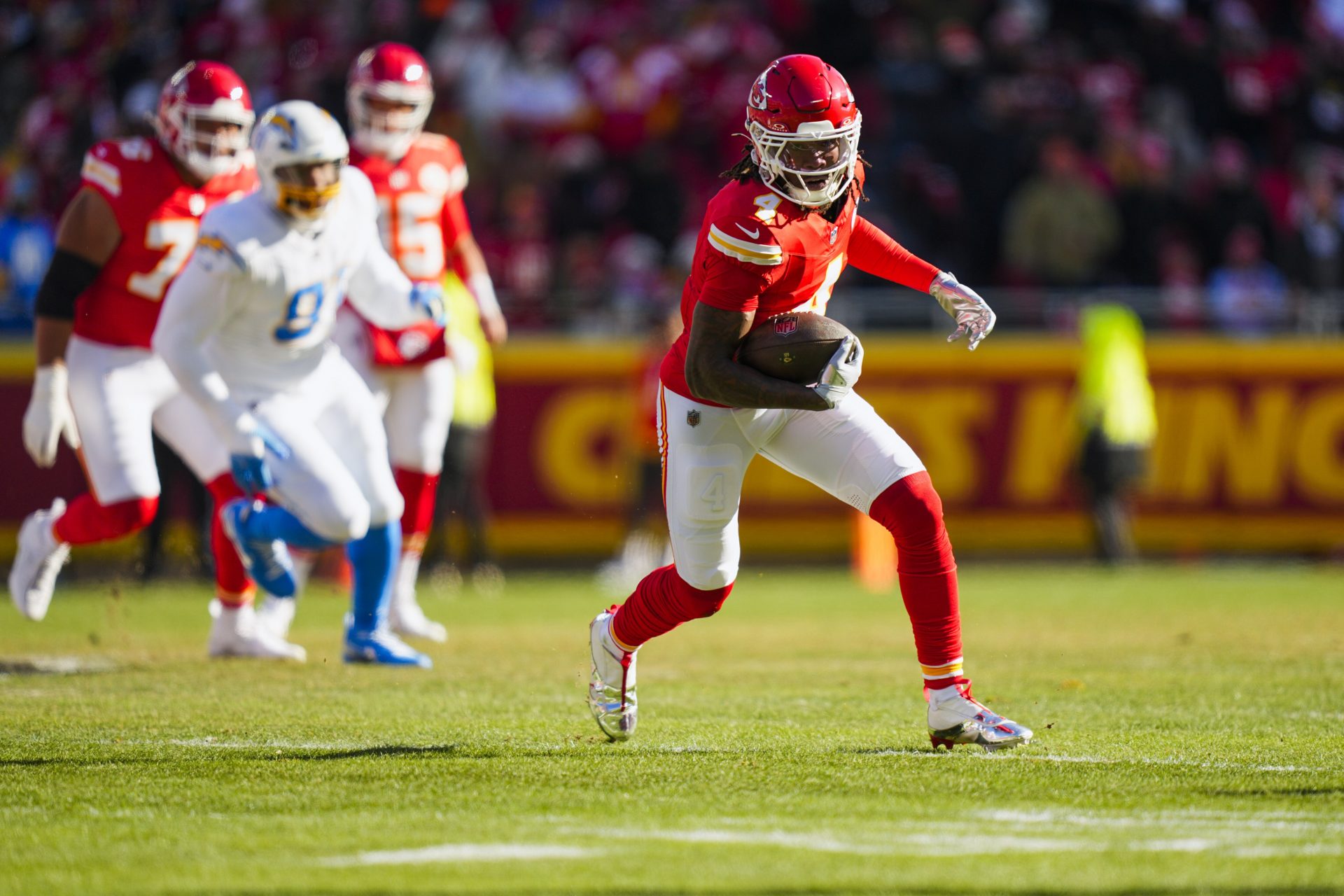 Kansas City Chiefs wide receiver Rashee Rice (4) runs for yards after the catch against the Los Angeles Chargers during the first quarter at GEHA Field at Arrowhead Stadium.