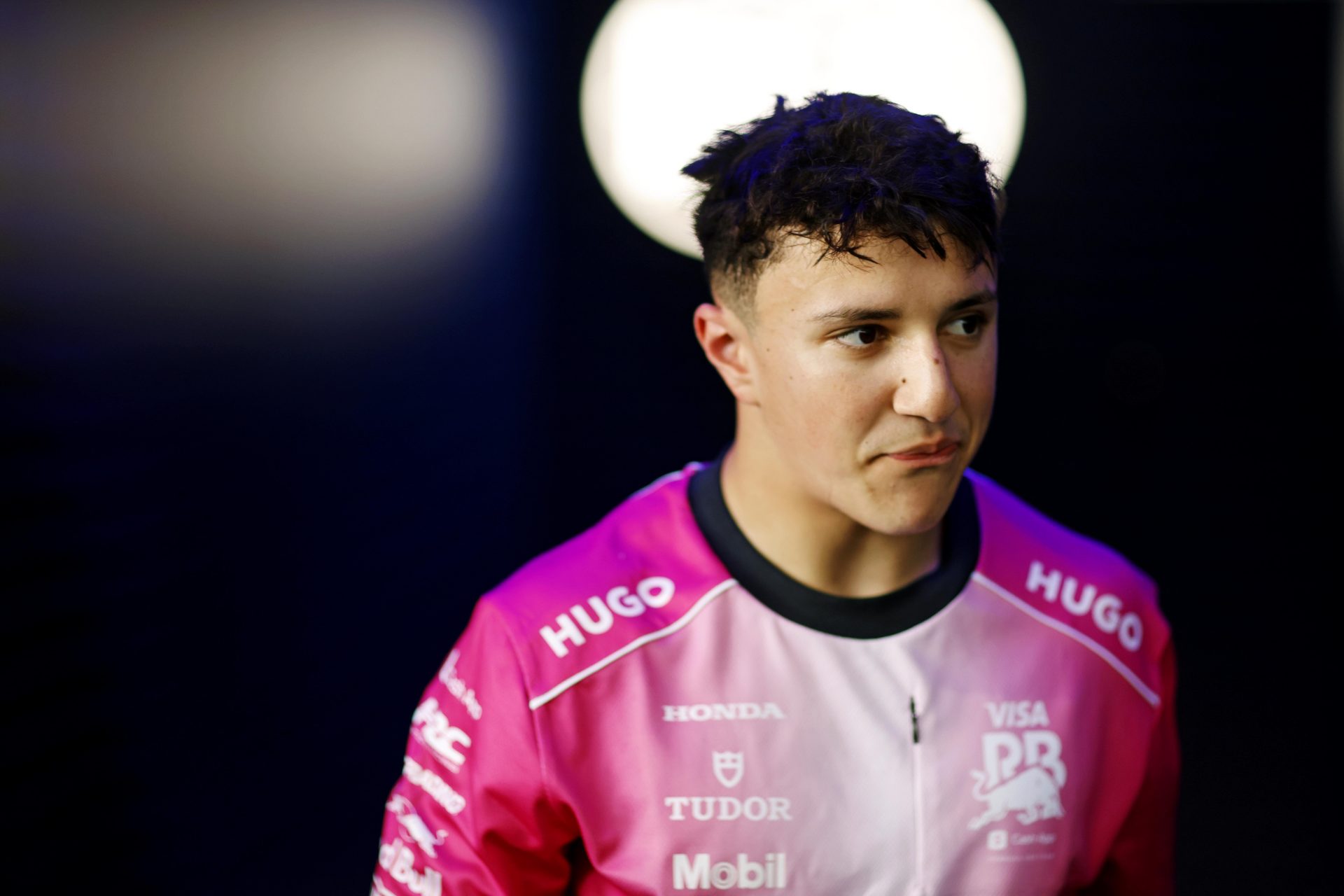 RB driver Isack Hadjar (6) walks out of the FIA garage after missing the final round  during qualifying for the F1 Miami Grand Prix at Miami International Autodrome.