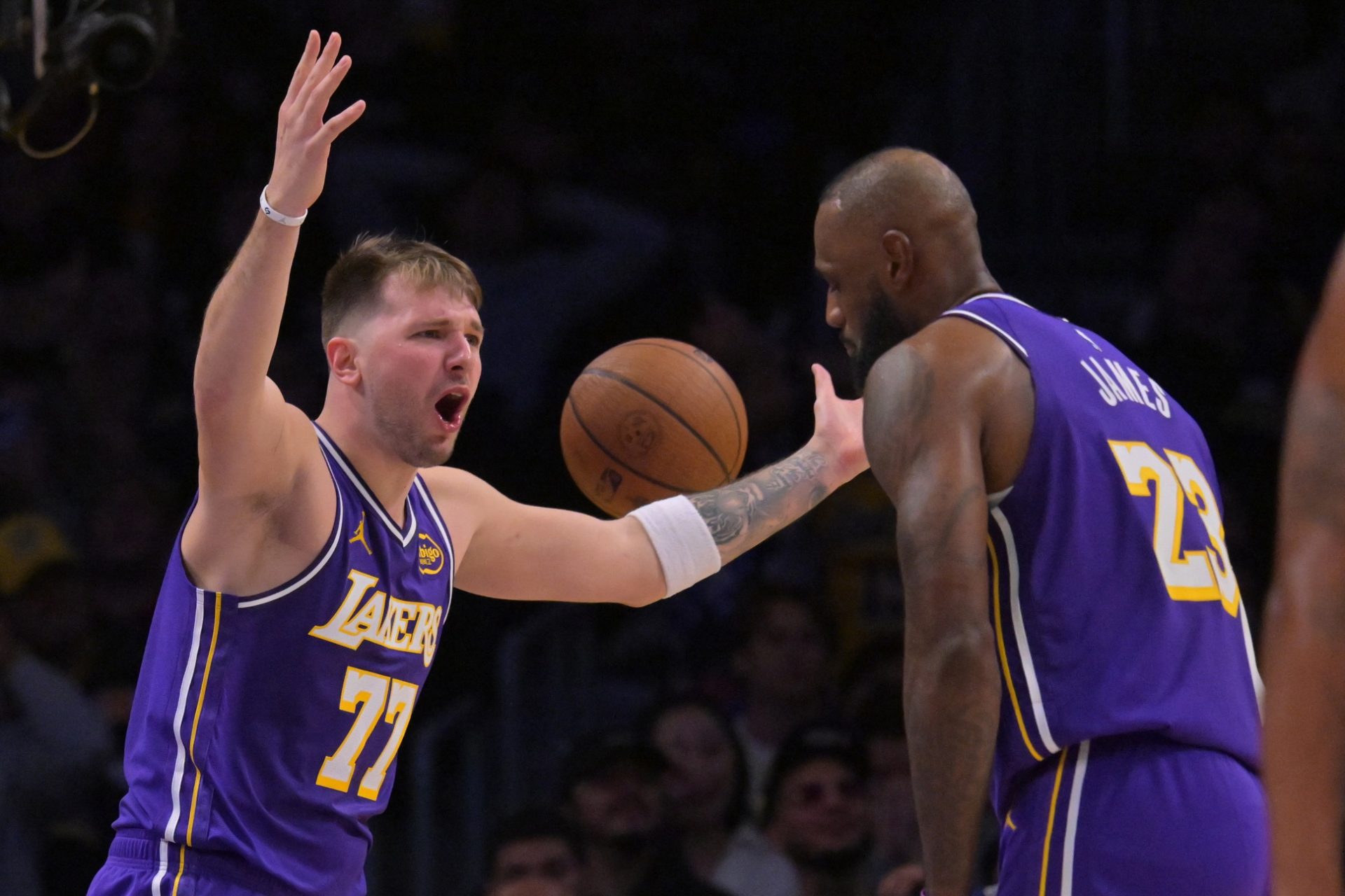 Los Angeles Lakers guard Luka Doncic (77) and forward Lebron James (23) react after a foul call during the second half against the San Antonio Spurs at Crypto.com Arena.
