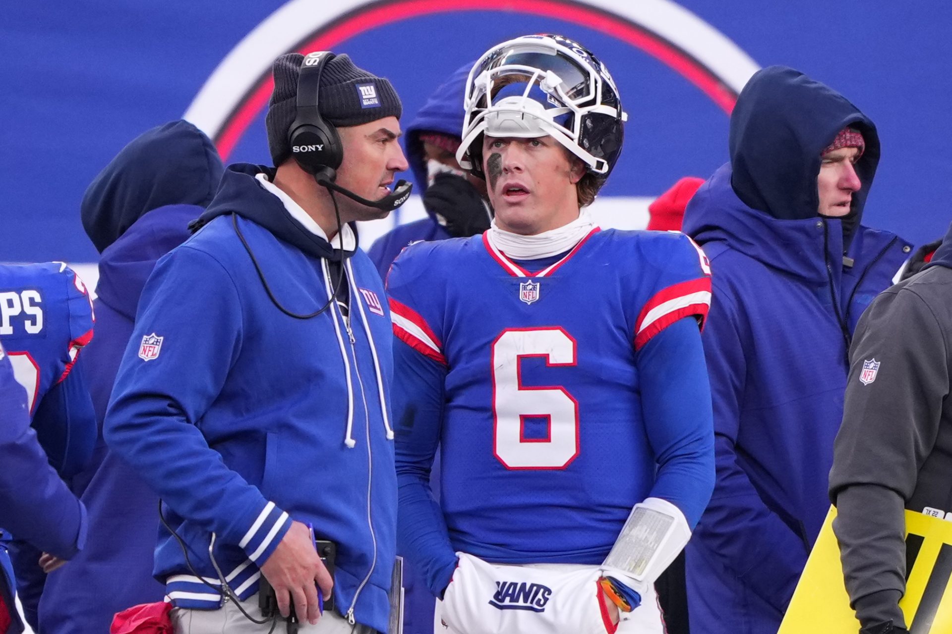New York Giants quarterback Jaxson Dart (6) talks with interim head coach Mike Kafka during the fourth quarter against the Washington Commanders at MetLife Stadium.