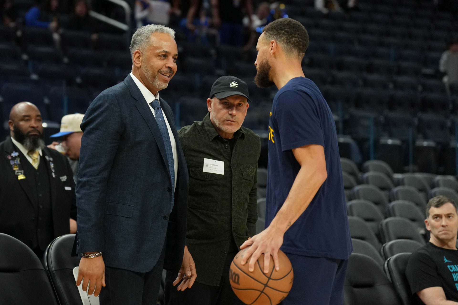 Charlotte Hornets color commentator Dell Curry (left) talks with Golden State Warriors guard Stephen Curry (right) before the game at Chase Center.