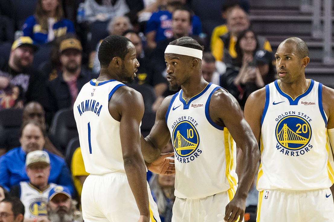 Golden State Warriors forward Jimmy Butler III (10) reacts  towards forward Jonathan Kuminga (1) during the second quarter against the Portland Trail Blazers at Chase Center.