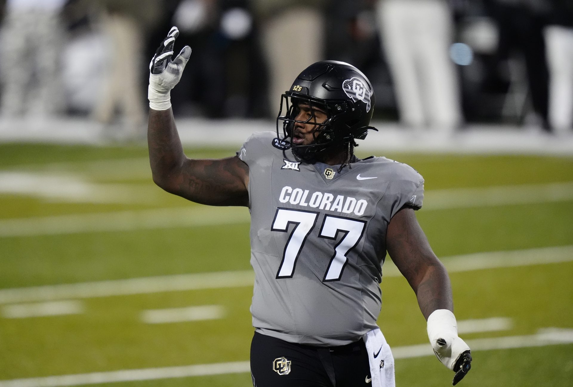 Colorado Buffaloes offensive lineman Jordan Seaton (77) reacts to a penalty called during the second quarter against the Arizona Wildcats at Folsom Field.
