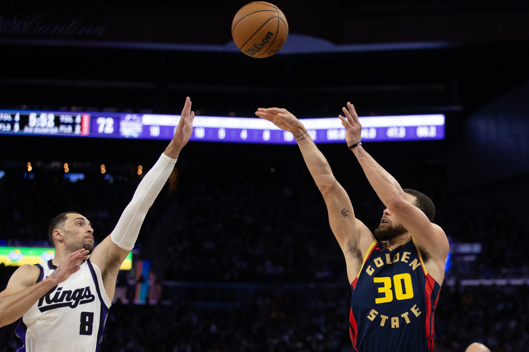Golden State Warriors guard Stephen Curry (30) shoots over Sacramento Kings guard Zach LaVine (8) during the third quarter at Chase Center.