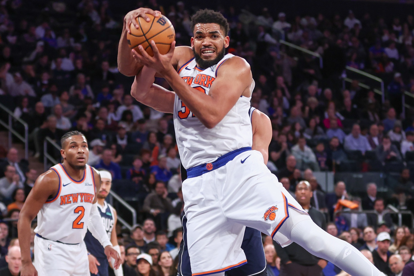 New York Knicks center Karl-Anthony Towns (32) rebounds the ball against the Dallas Mavericks during the fourth quarter at Madison Square Garden.