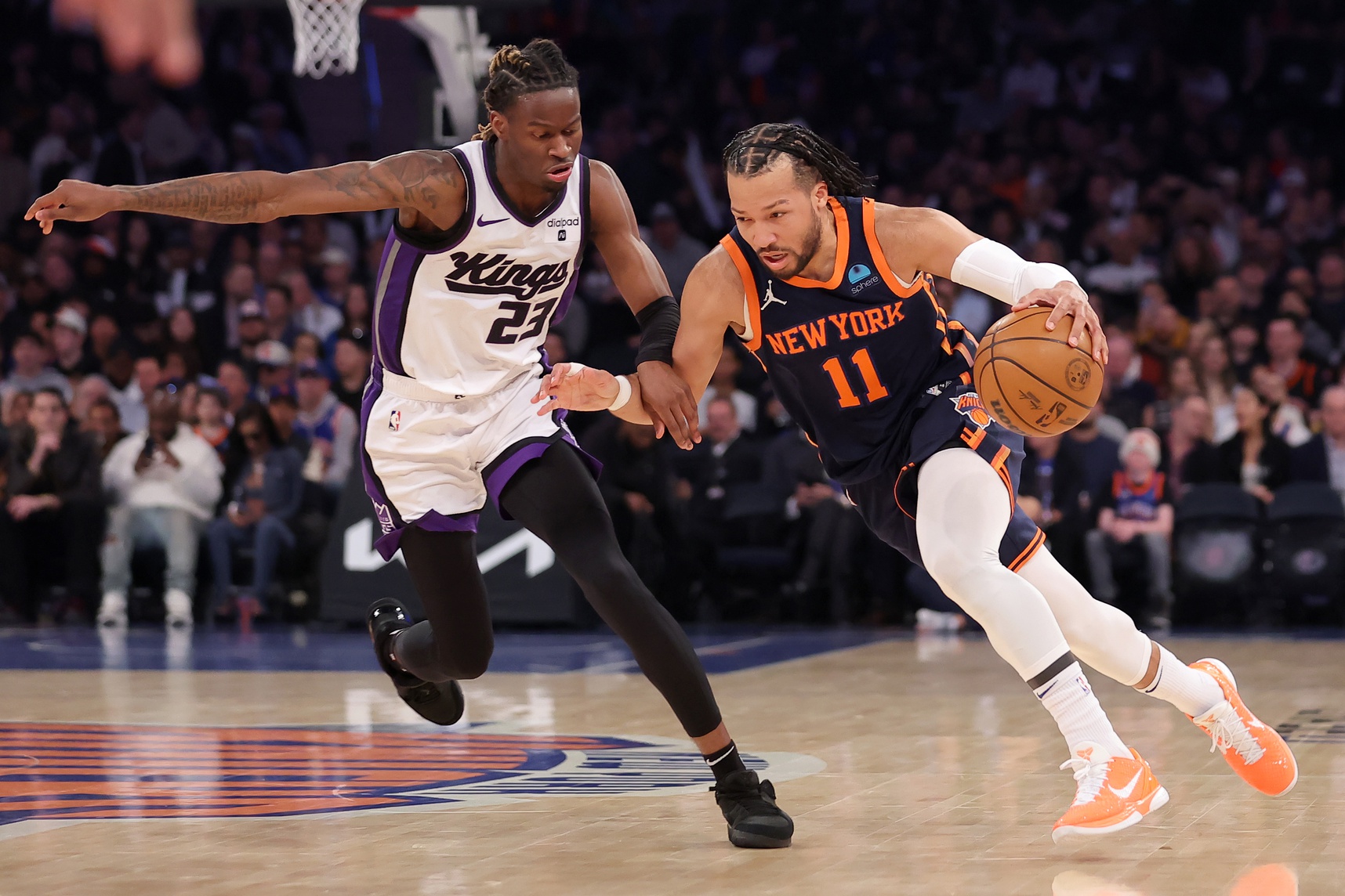 New York Knicks guard Jalen Brunson (11) drives to the basket against Sacramento Kings guard Keon Ellis (23) during the first quarter at Madison Square Garden.