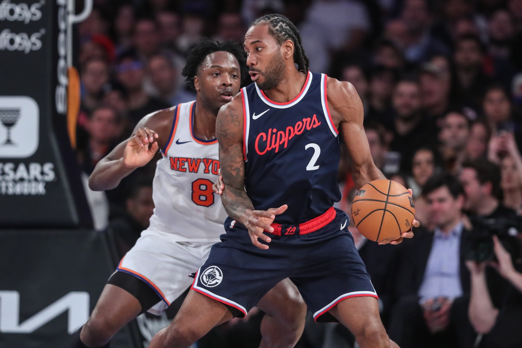 LA Clippers forward Kawhi Leonard (2) looks to post up against New York Knicks forward OG Anunoby (8) in the fourth quarter at Madison Square Garden.