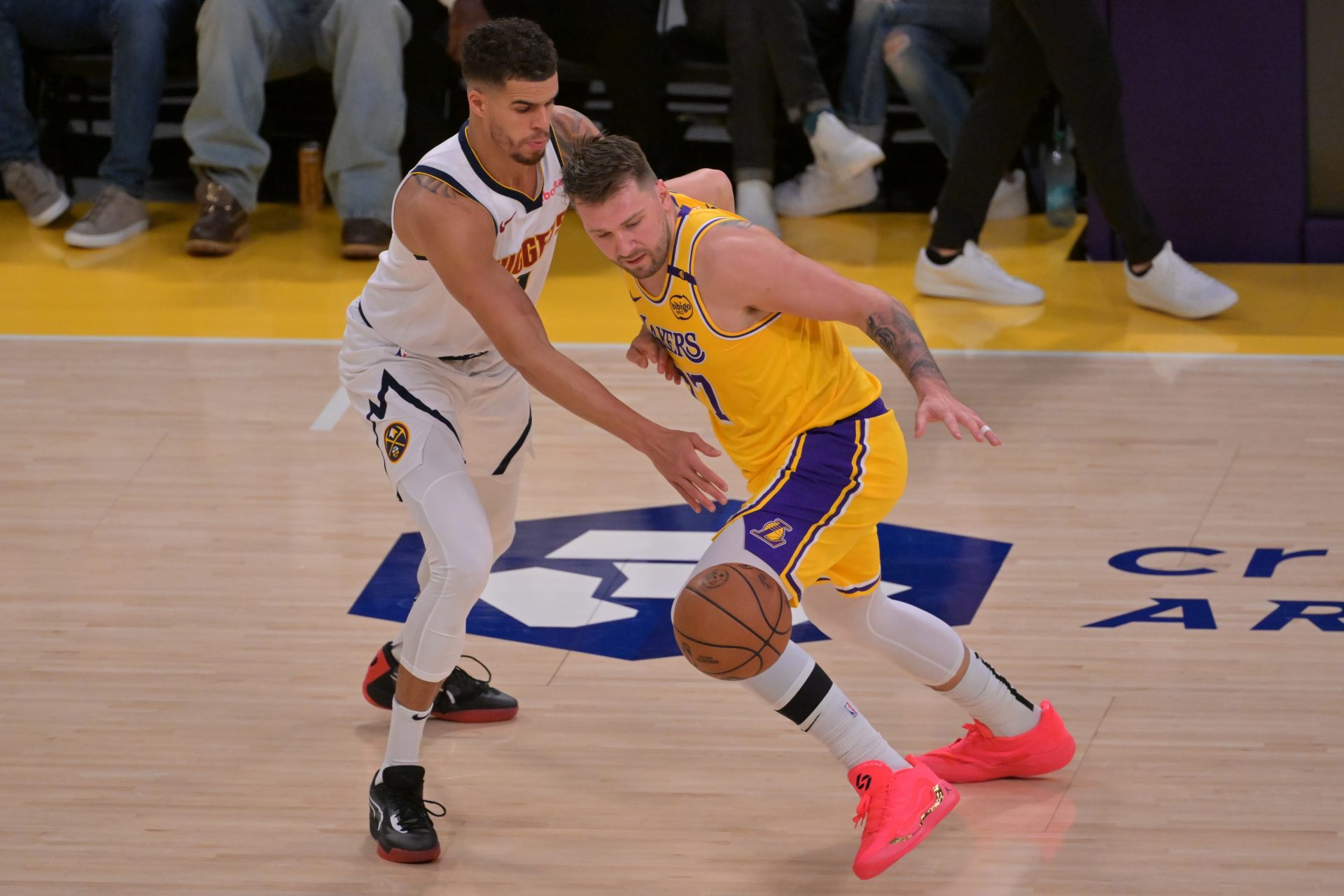 Denver Nuggets forward Michael Porter Jr. (1) guards Los Angeles Lakers guard Luka Doncic (77) in the first half at Crypto.com Arena.