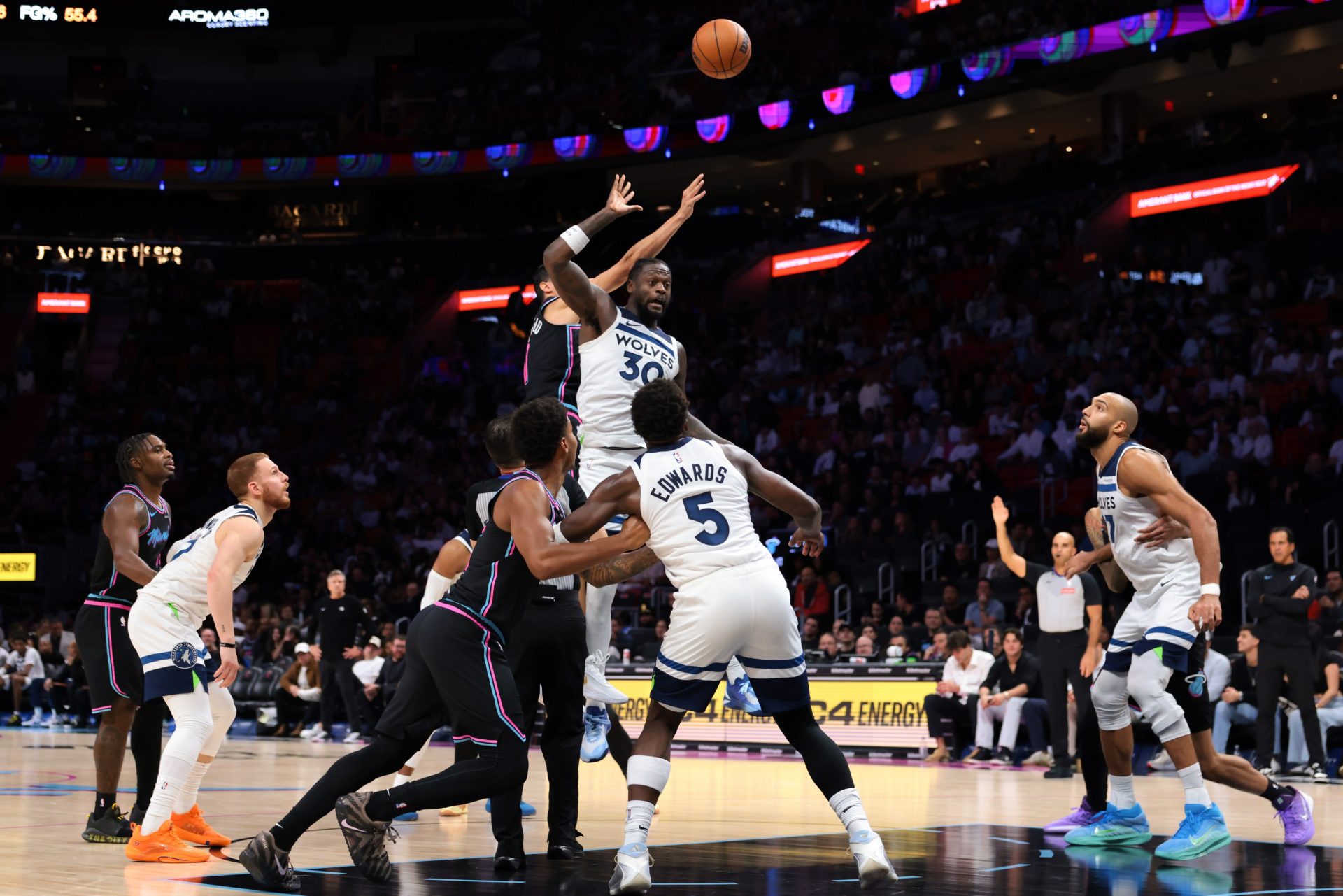 Minnesota Timberwolves forward Julius Randle (30) and Miami Heat forward Simone Fontecchio (0) jump ball during the fourth quarter at Kaseya Center.