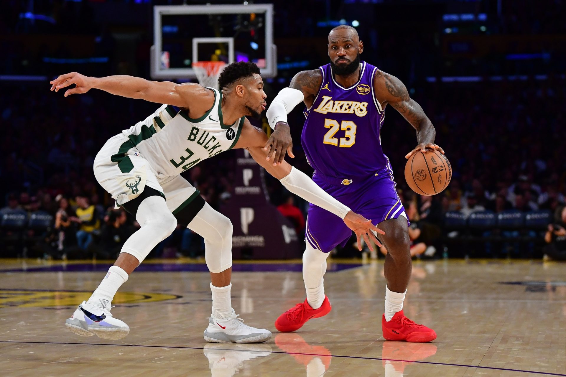 Los Angeles Lakers forward LeBron James (23) moves the ball against Milwaukee Bucks forward Giannis Antetokounmpo (34) during the second half at Crypto.com Arena.