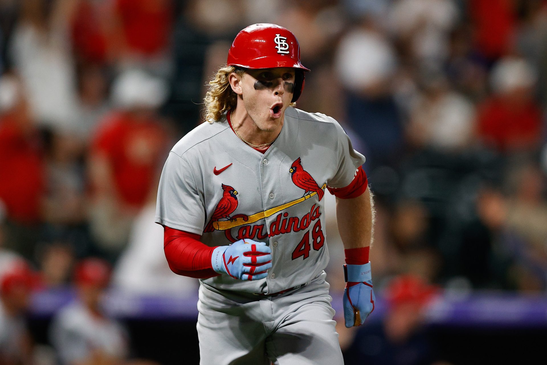 Harrison Bader (48) reacts after hitting a grand slam in the tenth inning against the Colorado Rockies at Coors Field.