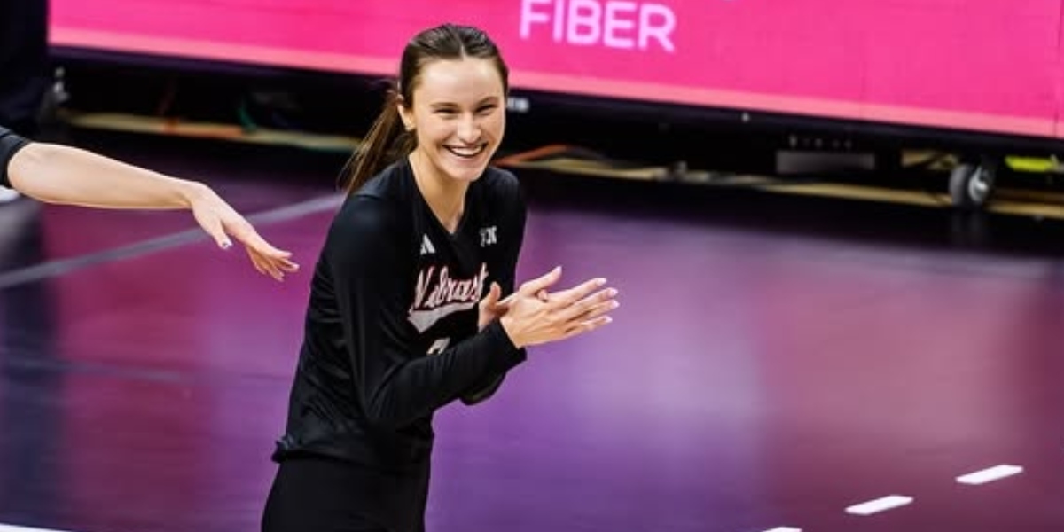 Nebraska volleyball player Bergen Reilly cheers for Lexi Rodriguez's first match of the season with her younger sister