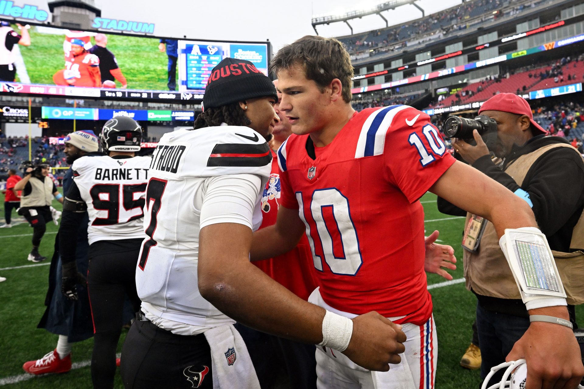Houston Texans quarterback C.J. Stroud (7) hugs New England Patriots quarterback Drake Maye (10) after a game at Gillette Stadium.