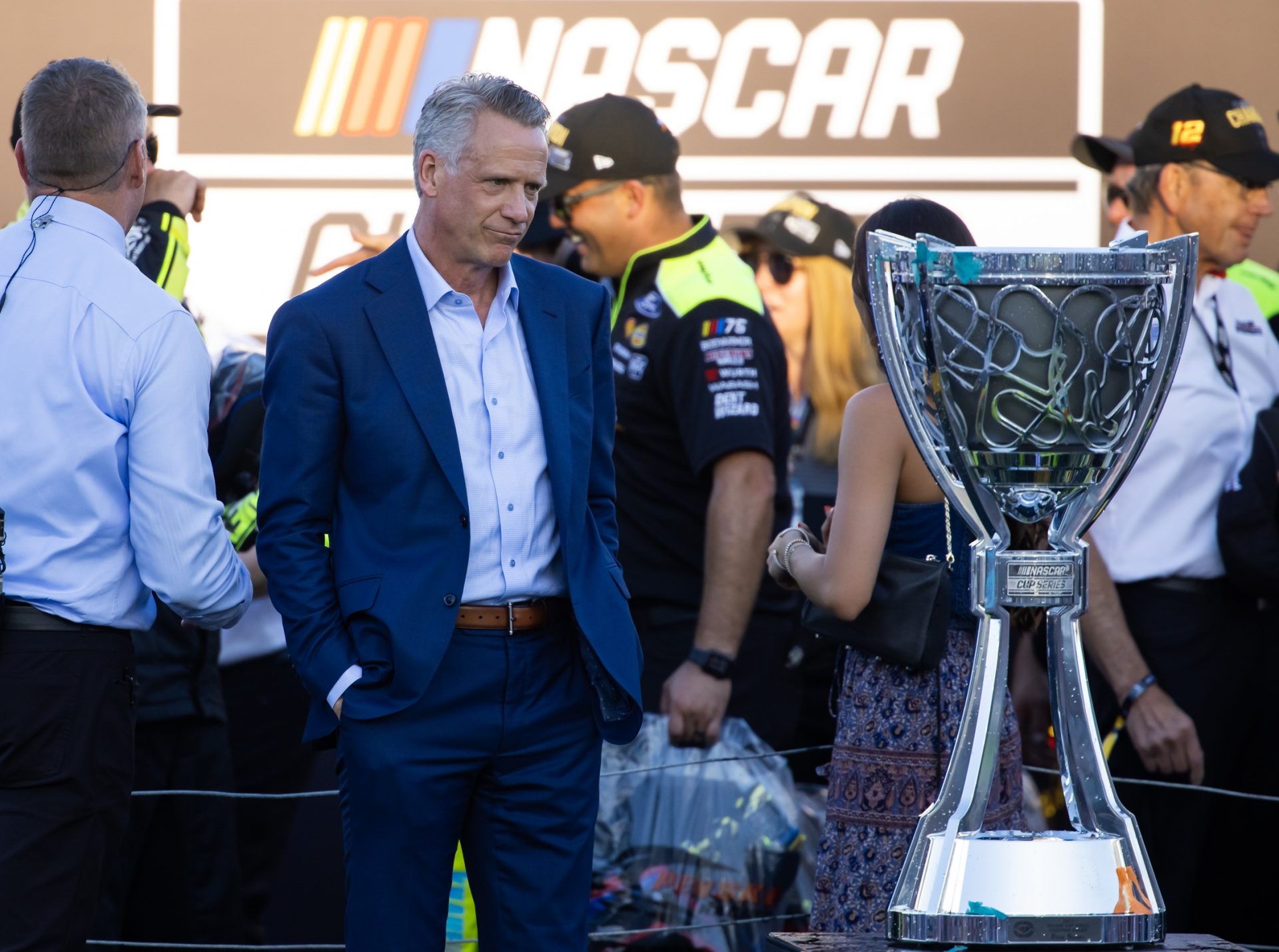 NASCAR president Steve Phelps looks at the Bill France Cup championship trophy during the Championship Race at Phoenix Raceway.
