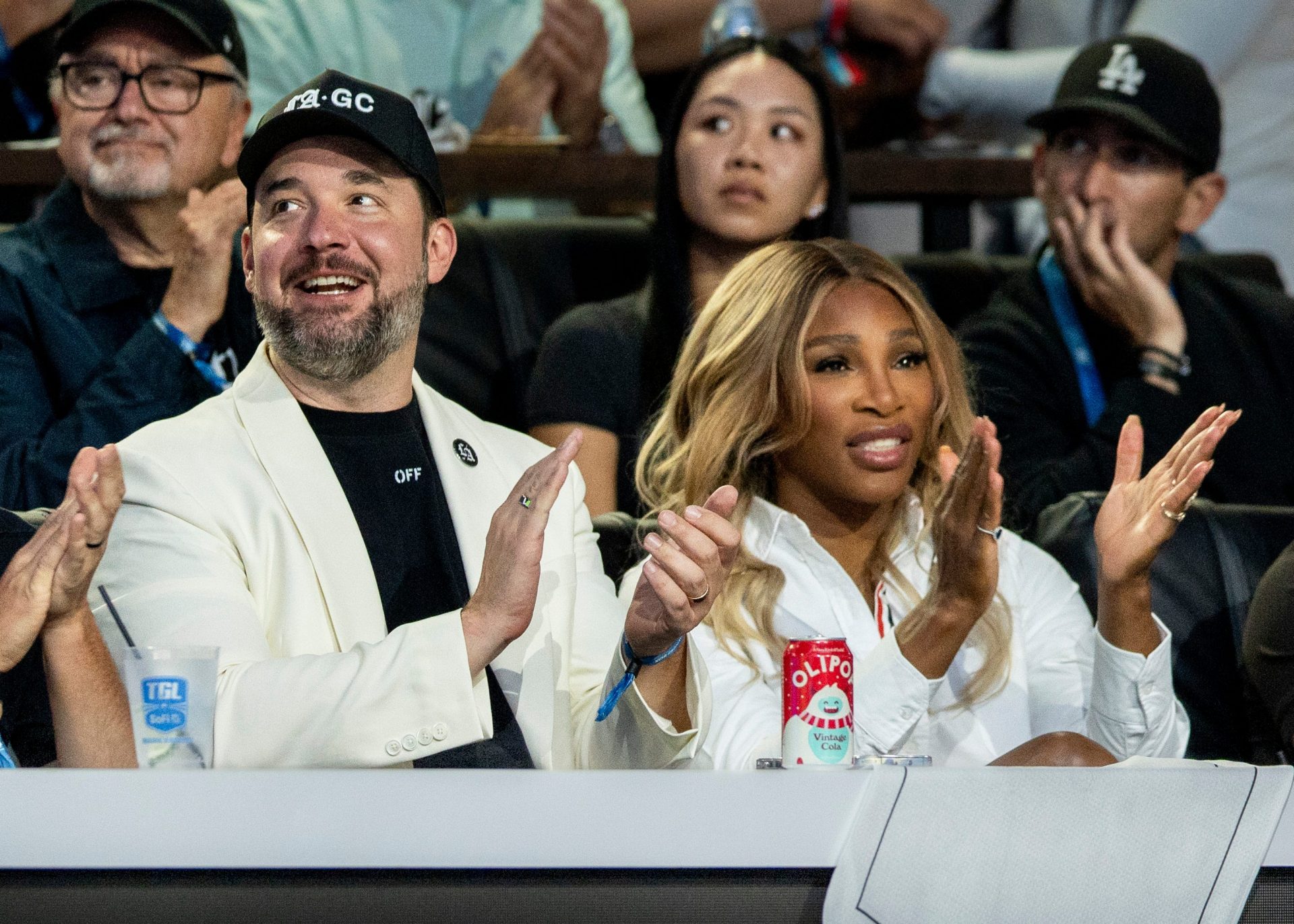 Los Angeles Golf Club owners Alexis Ohanian and Serena Williams cheer for their team against the New York Golf Club during the TGL semifinal match at SoFi Center on March 17, 2025, in Palm Beach Gardens, Florida.