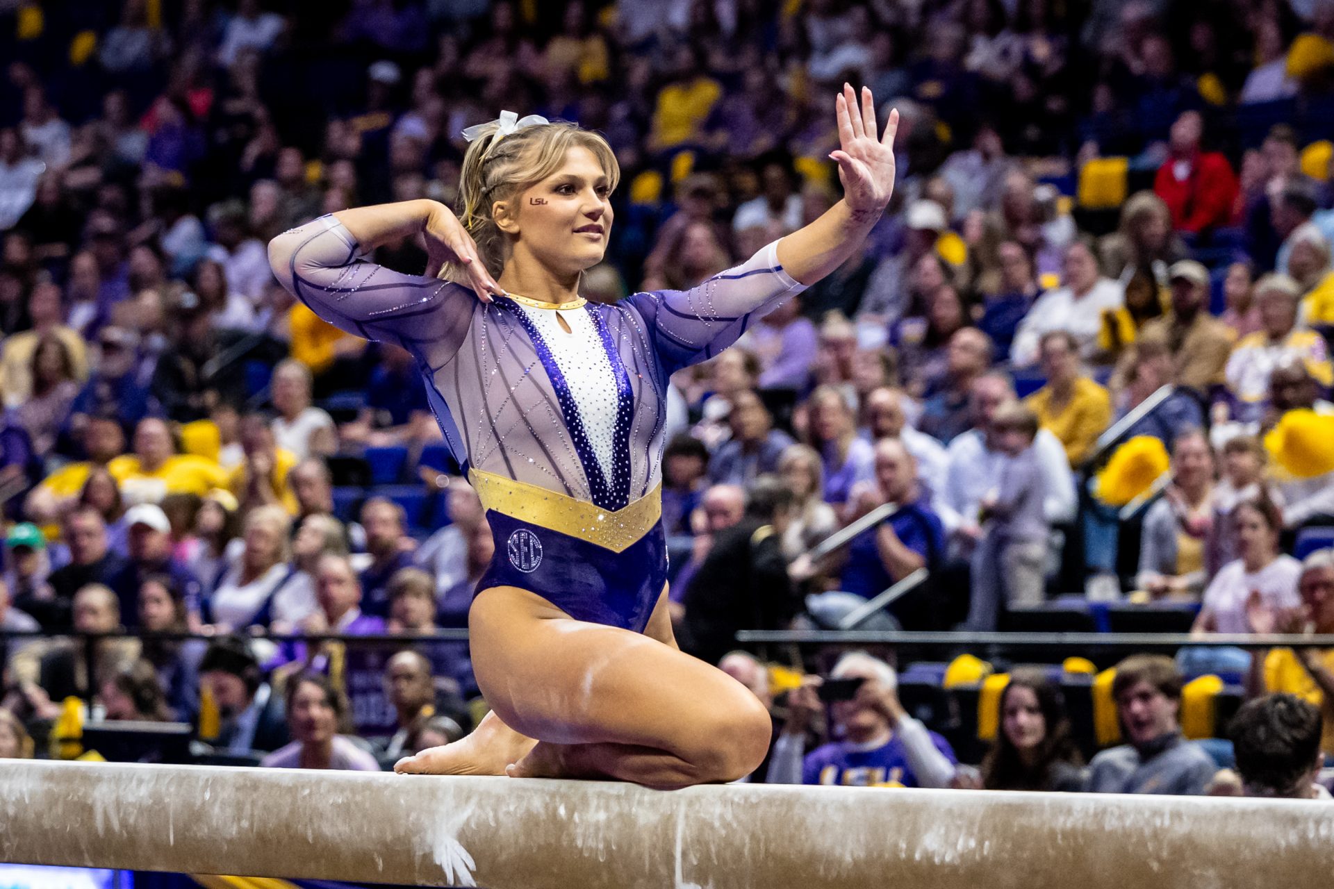 Sierra Ballard performs on the balance beam during the meet against the Georgia Bulldogs at Maravich Center.