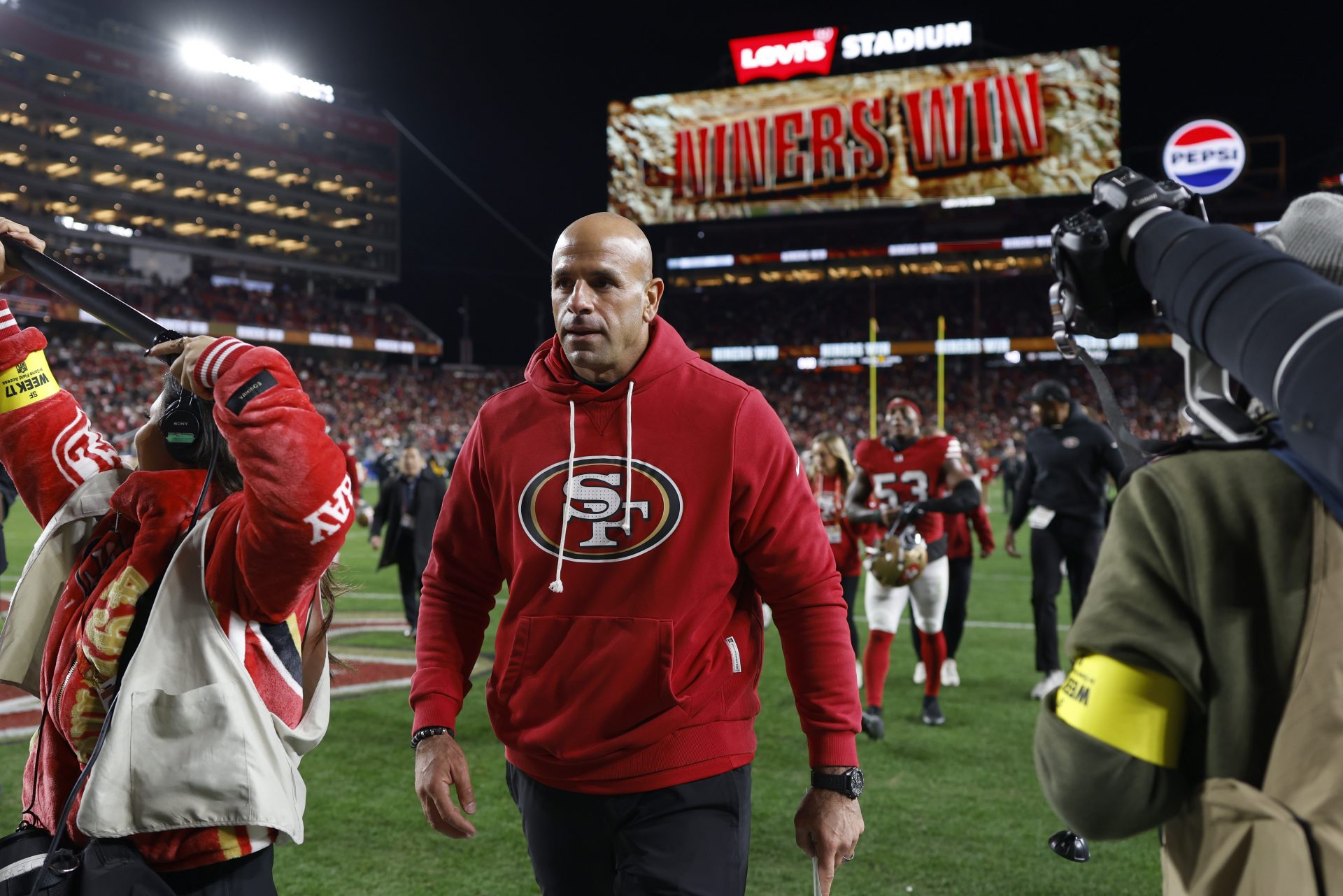 San Francisco 49ers defensive coordinator Robert Saleh leaves the field after defeating the Chicago Bears at Levi's Stadium.