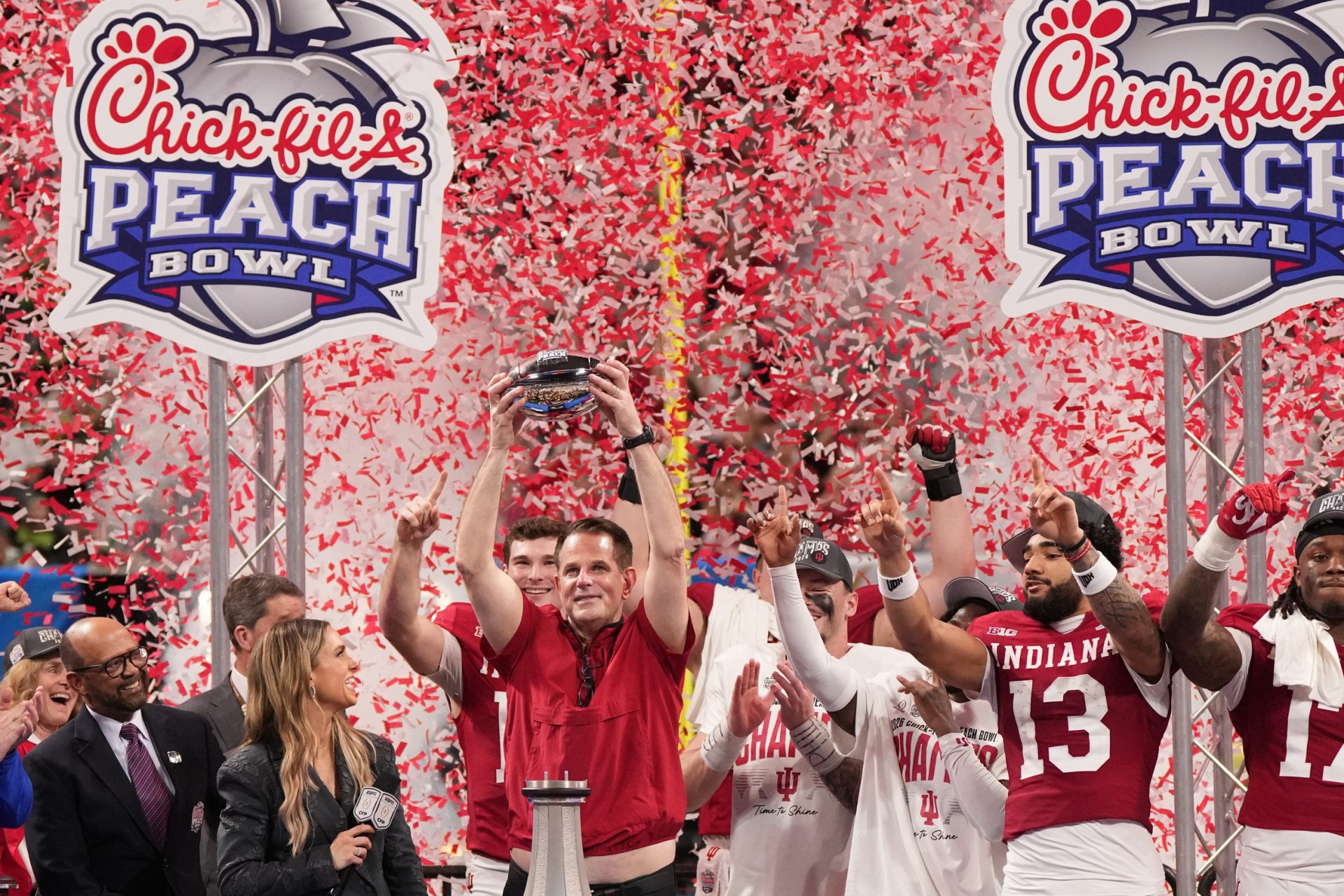 Indiana Hoosiers head coach Curt Cignetti raises the trophy after the 2025 Peach Bowl and semifinal game of the College Football Playoff against the Oregon Ducks at Mercedes-Benz Stadium.
